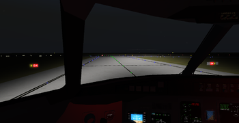 Holding short at B in a CRJ-700 (at night).