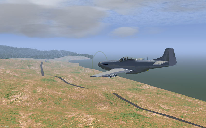 File:Fully armed P-51-25NA over the coast..jpg