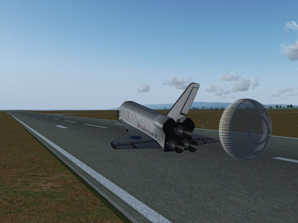 Touchdown of the Space Shuttle and drag chute deployed