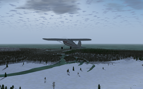 Cessna 140 approaching a frozen-over Georgian Bay (Lake Huron) in winter, near Goderich ON (CYGD).