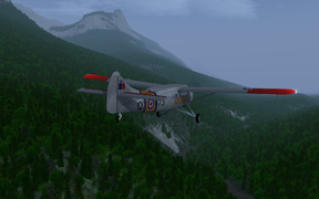 SAR DHC-3 Otter flying through the Rocky Mountains near Jasper AB (CYJA).