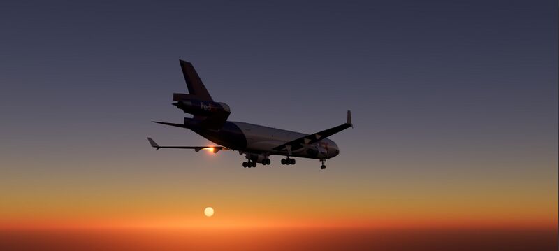 File:SOTM 2021-11 Right after takeoff in sunset in the (MD-11F, FedEx livery) with early WiP HDR pipeline in FG next branch by SP-NTX.jpg