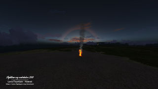 Ice crystals from a 22 degree halo. The halo is red as the light reaching it is red (out-scattering). Flightgear.