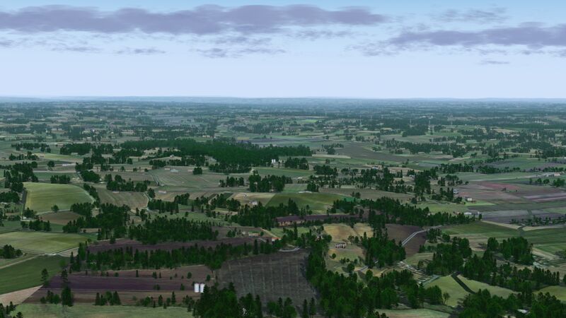 File:Rolling agricultural lands stretching away to the horizon in southern France in FlightGear 2020.x 02.jpg