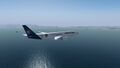 Lufthansa Cargo Boeing 777 over the sea of mountains.jpg